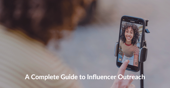 A woman holding a phone. "Complete Guide to Influencer Marketing"